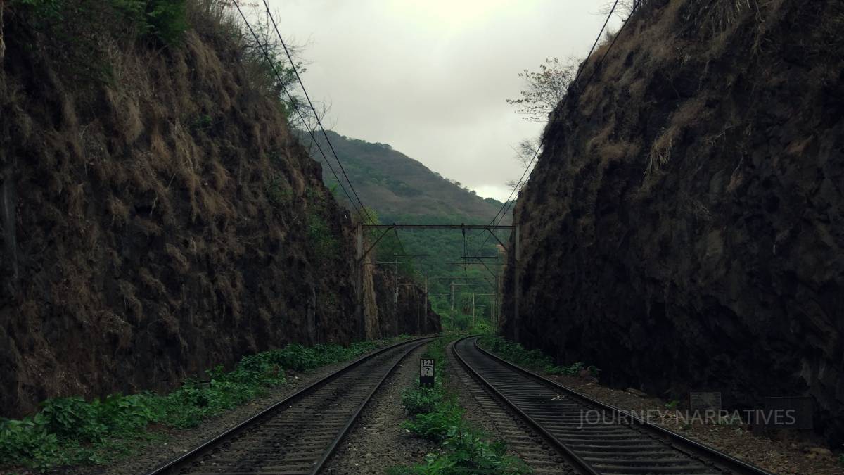 Scenic train journey through India showcasing sustainable travel and beautiful landscapes along the route