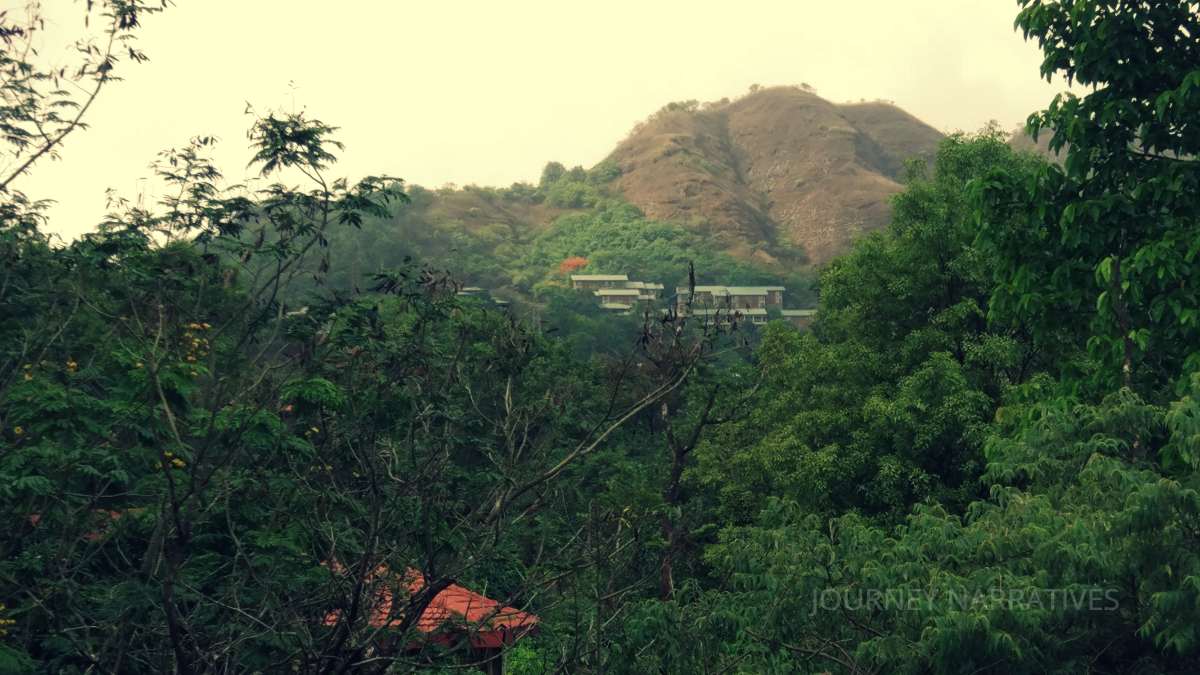 Scenic mountain view from a hotel window representing affordable and well-planned travel experiences in India