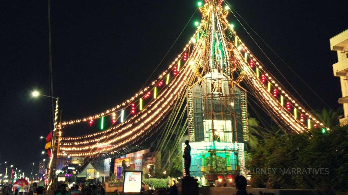 Festive atmosphere during Vizag Utsav featuring lights, crowds, and cultural celebrations at night