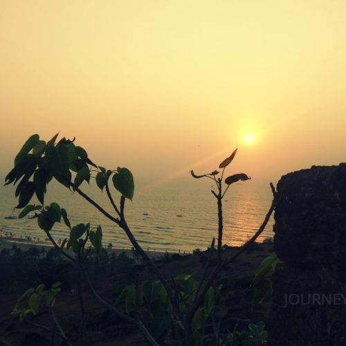 Sunset view from Chapora Fort in North Goa overlooking the Arabian Sea and scenic coastline
